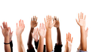 Children raising their hands in the air