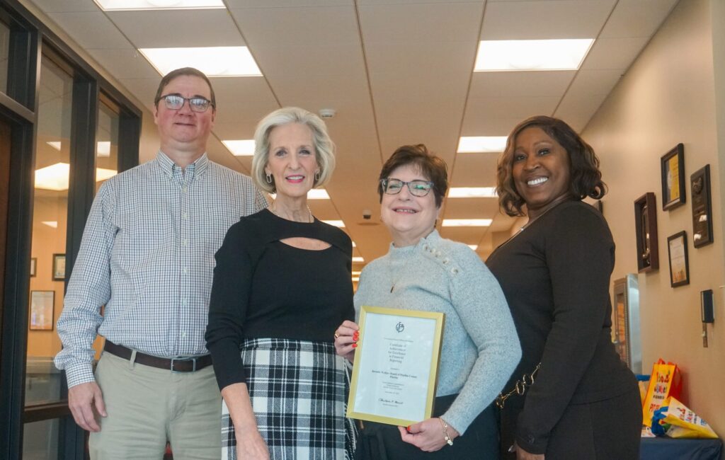 (l to r) JWB Senior Accountant Richard Godfrey, Chief Financial Officer Laura Krueger Brock, Senior Manager of Accounting Lynn De la Torre, and JWB Board Chair Judge Patrice Moore with JWB's 4th GFOA Award