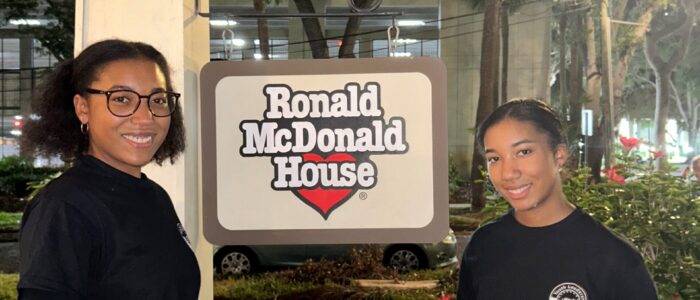 YLC team members in front of Ronald McDonald sign