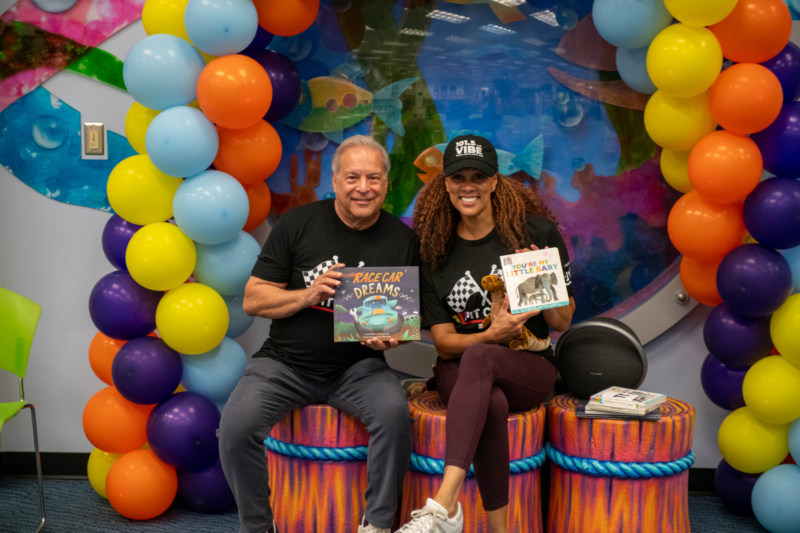 JWB Interim CEO and Hazely Lopez of Univision holding children's books