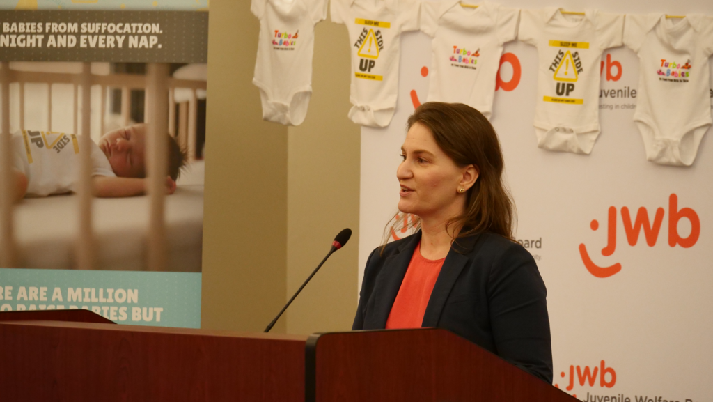 Children’s Movement CEO Madeleine Thakur at the podium
