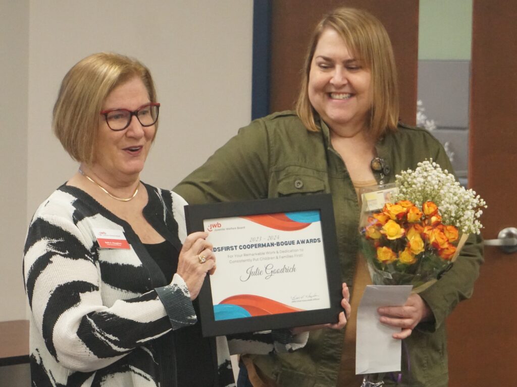 JWB CEO present a KidsFirst Award to Julie Goodrich, RN, of Florida Department of Health Nurse-Family Partnership Program
