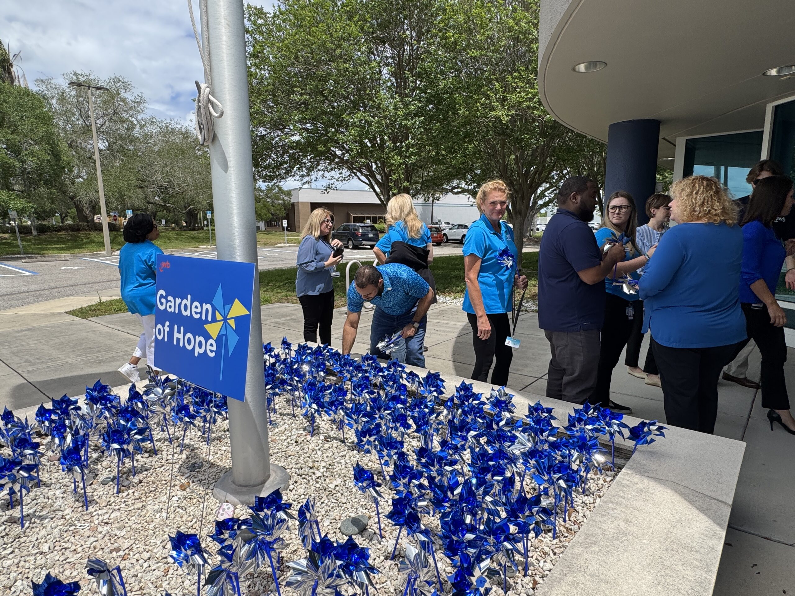 JWB staff planted a pinwheel Garden of Hope in front of our offices for CAP Month